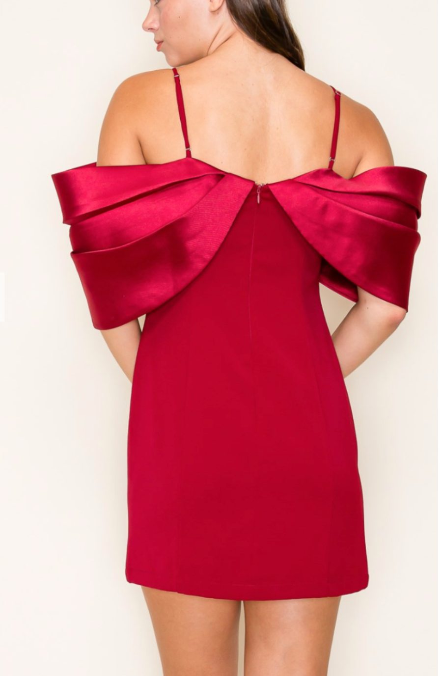 model is wearing a red off the shoulder mini dress