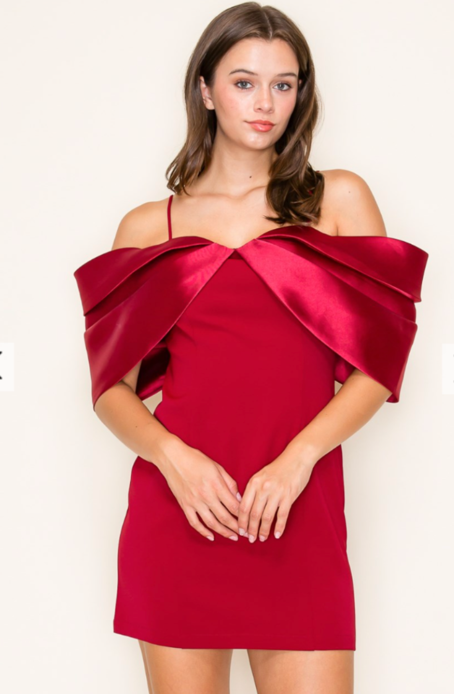 model is wearing a red off the shoulder mini dress