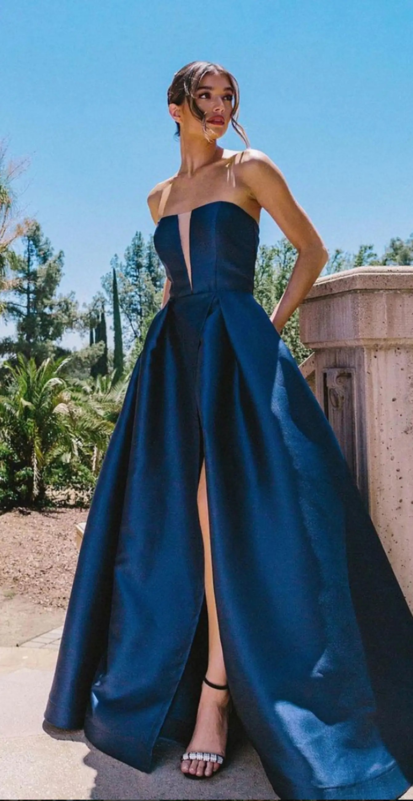 Model in a black mother of the bride dress