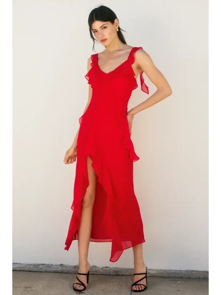 A model wearing a fitted red dress, standing against a plain white background.