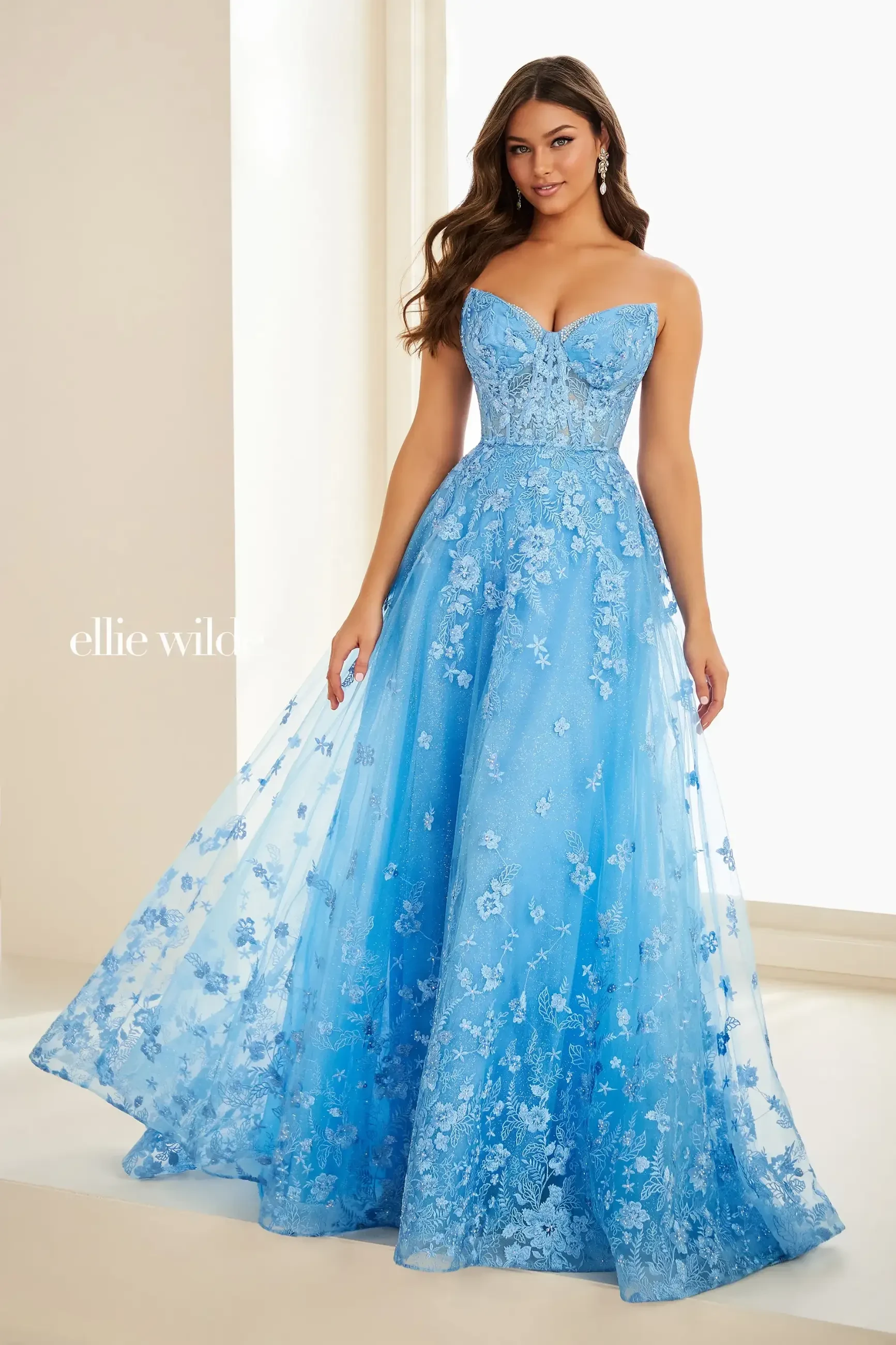 image shows model wearing a light blue prom dress