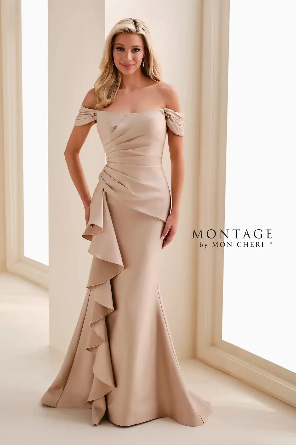 model is wearing an off the shoulder gold gown
